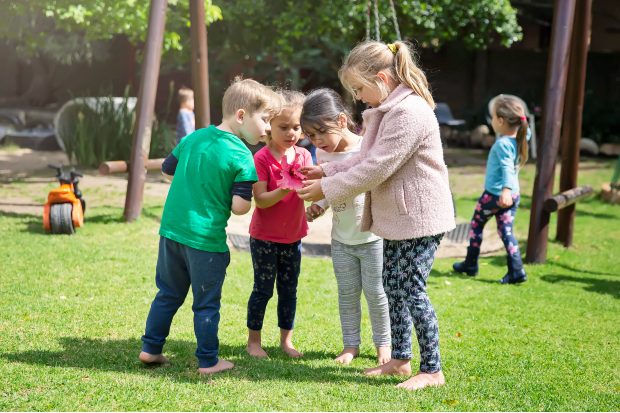 children-looking-at-flowers