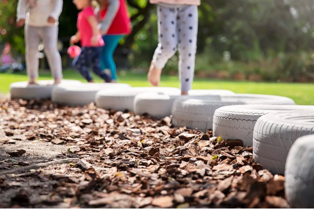 children-running-through-tyres-1